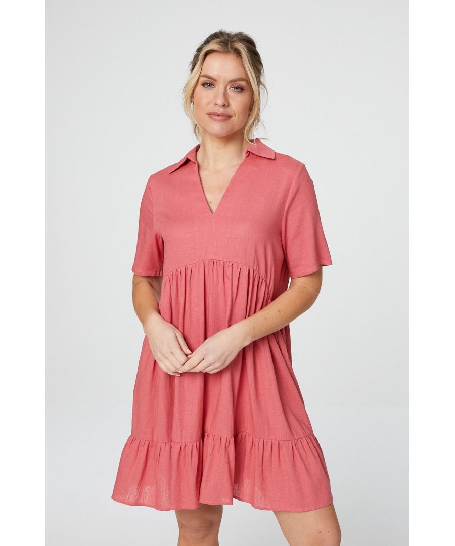 Make a statement in this comfortable tiered smock dress. With a collared v-neck, short sleeves, a flattering curved empire waist, a tiered short skirt, an oversized fit and a lightweight linen fabric perfect for warm days. Pair with trainers for a dressed down weekend outfit.