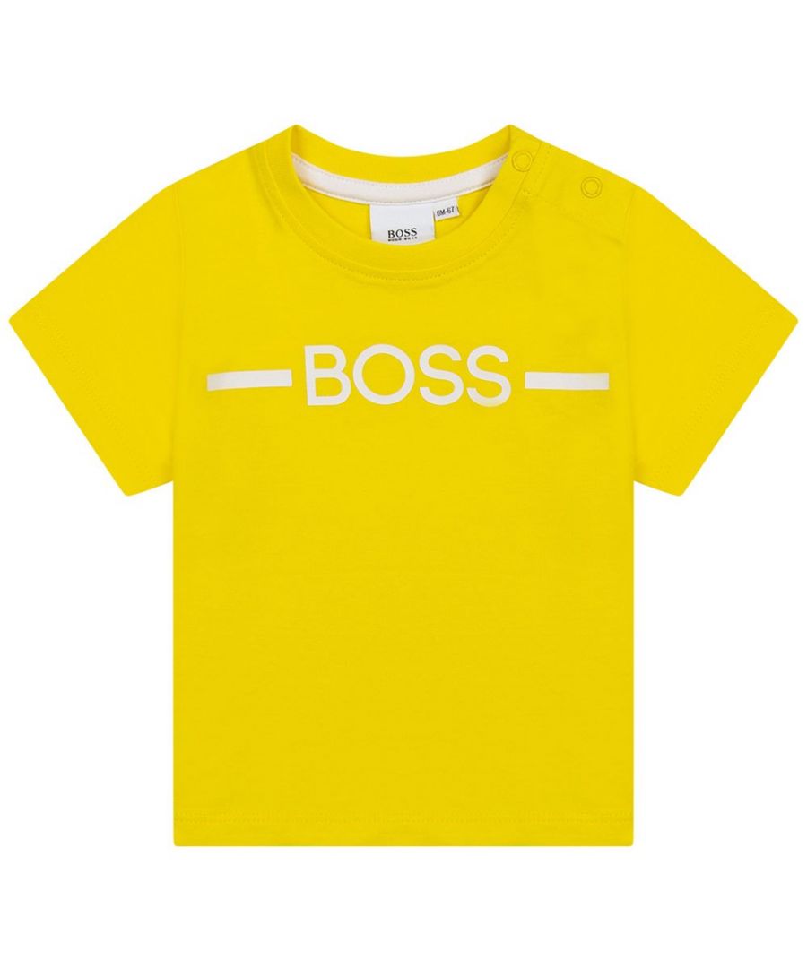 This Hugo Boss Baby Boys Logo T-shirt in Yellow and features the Boss logo print at the front and snap button fastening at the shoulder.\n\nThe BOSS logo is printed in large contrasting letters on the front\nThe design has a press stud fastening at the shoulder