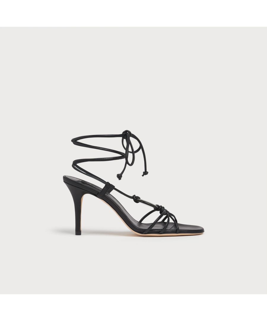 Chic and strappy, our Nimes stiletto sandals have a barely-there look and stylish detail. Crafted in Italy from beautiful black nappa leather, they have triple straps over the toes, a faux mother-of-pearl disc on top of the foot, strappy ankle ties and a 90mm stiletto heel. The perfect pair of sandals for the summer season, wear them to parties and for dressy occasions.