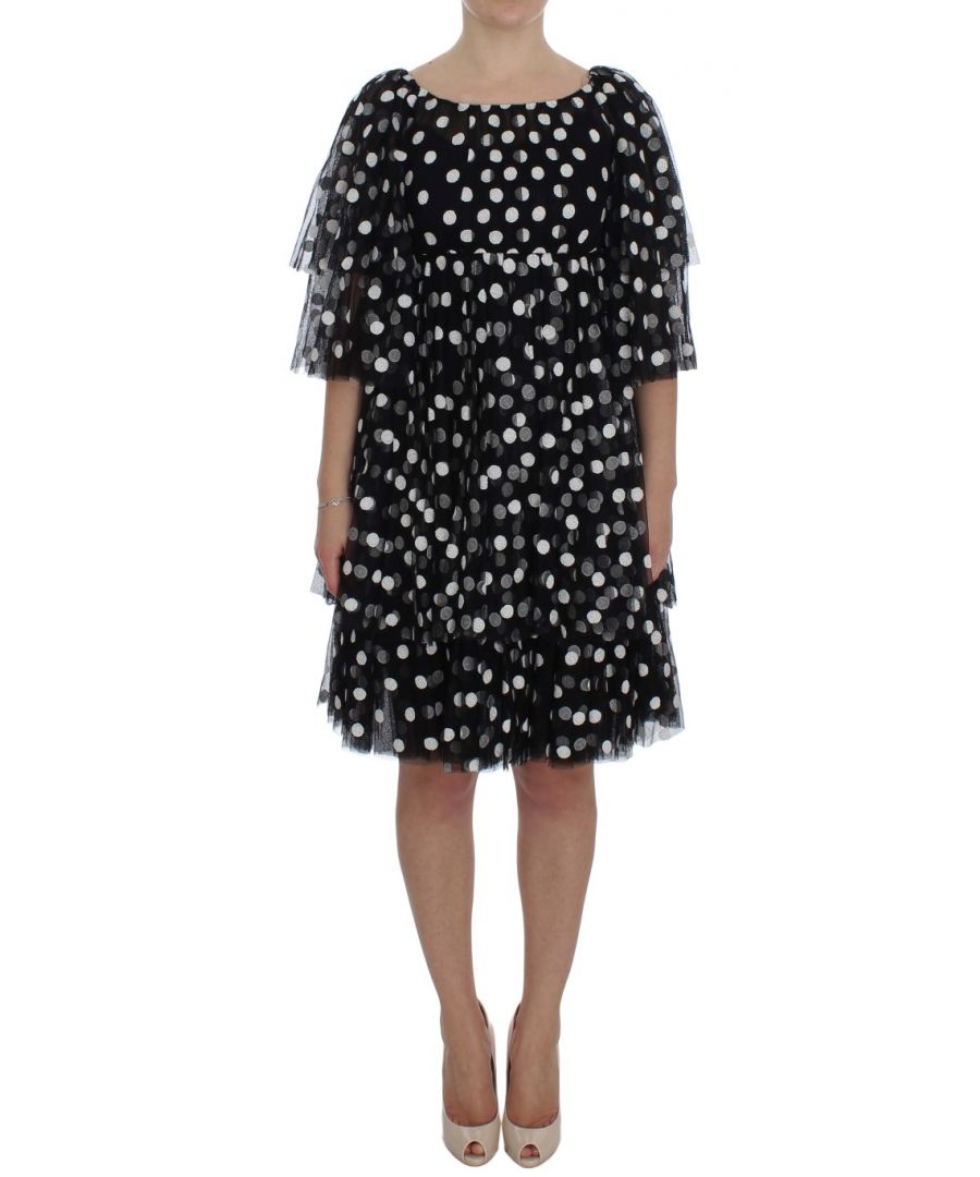 Dolce & ; Gabbana Gorgeous brand new with tags, 100% Authentic DOLCE & ; GABBANA black and white polka dotted ruffled dress Model : Above knee length shift Color : Black and white polka dotted Back zipper closure Logo details Made in Italy Material : 33% Cotton, 58% PA, 9% PL