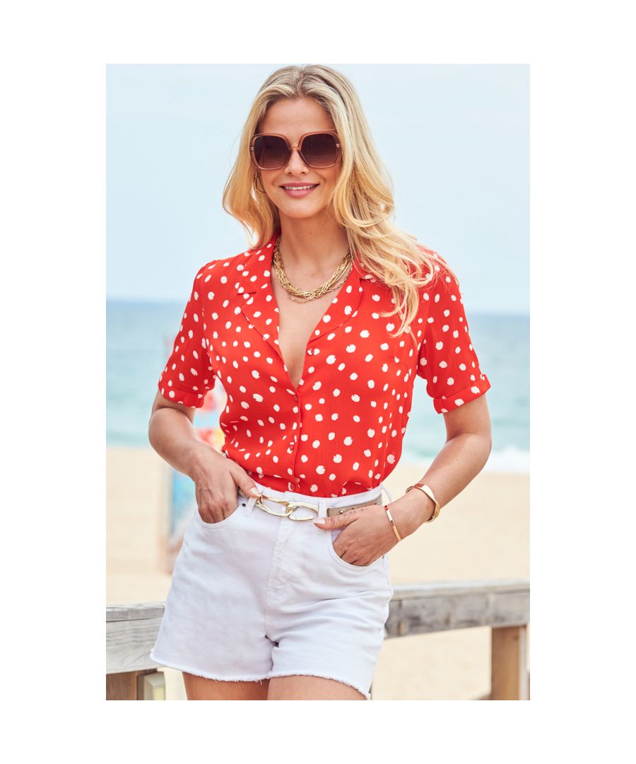 REASONS TO BUY: \n\nA work-to-weekend classic\nWe can't get anough of spot print\nChic revere collar\nBody-skimming fit for comfort and style\nKnot it at the front or try a half tuck\nWhite denim shorts make the perfect match