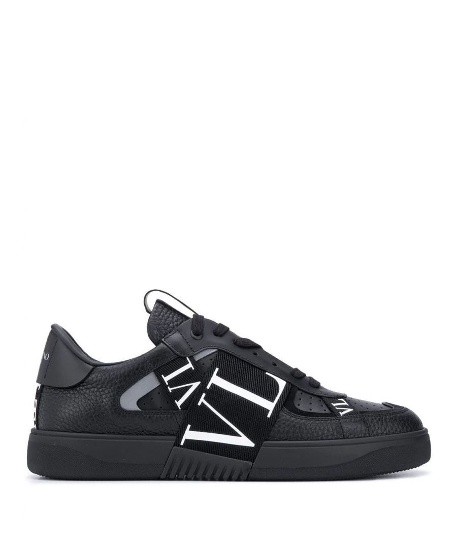 Merging practicality and style in one, Valentino Garavani's VL7N low-top sneakers are detailed with branded straps that cover the sneakers front foot. Produced in black leather, they showcase the label's contemporary mood.\n\n\n\nblack\nleather\nlogo-print strap\nround toe\nfront lace-up fastening\nlogo patch at the tongue