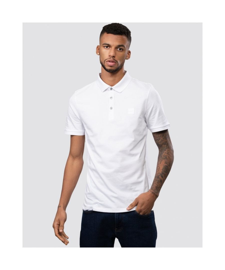 A short-sleeved polo shirt cut to a slim fit, by BOSS Menswear. Trimmed with a tonal logo patch at the left chest, this super-soft polo shirt is crafted in stretch-cotton piqué for everyday comfort.\nSlim fitFlat-knit collarNumber of buttons: 3Short sleevesFlat-knit cuffs\n97% Cotton, 3% Elastane Ribbing: 100% Cotton            \n50472668
