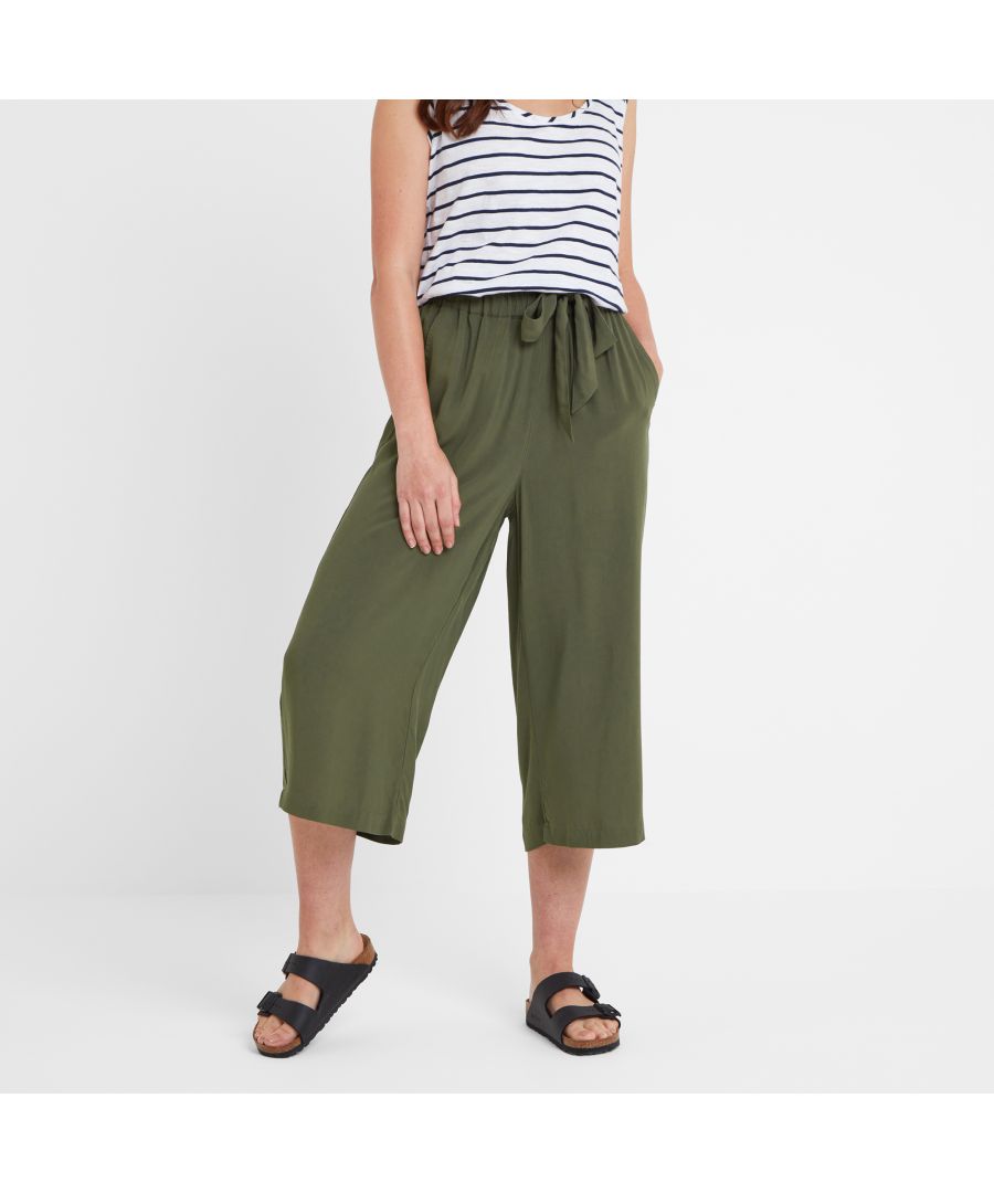 Versatile and super easy to wear, our Cassie Women’s lightweight culottes can be dressed up or down to suit most occasions. Simply switch tops and accessories and you’re ready to go, whether heading for the office, out for an evening with friends or just relaxing at home. Soft and floaty with wide legs, a comfortable, elasticated waistband and a simple, matching fabric tie, Cassie is also a perfect choice for keeping cool in the heat. Two angled front pockets are ideally placed for slipping your hands into or storing essentials such as a phone or keys. And the finishing touch? Our small embroidered rose logo discreetly sewn below one of the pockets.