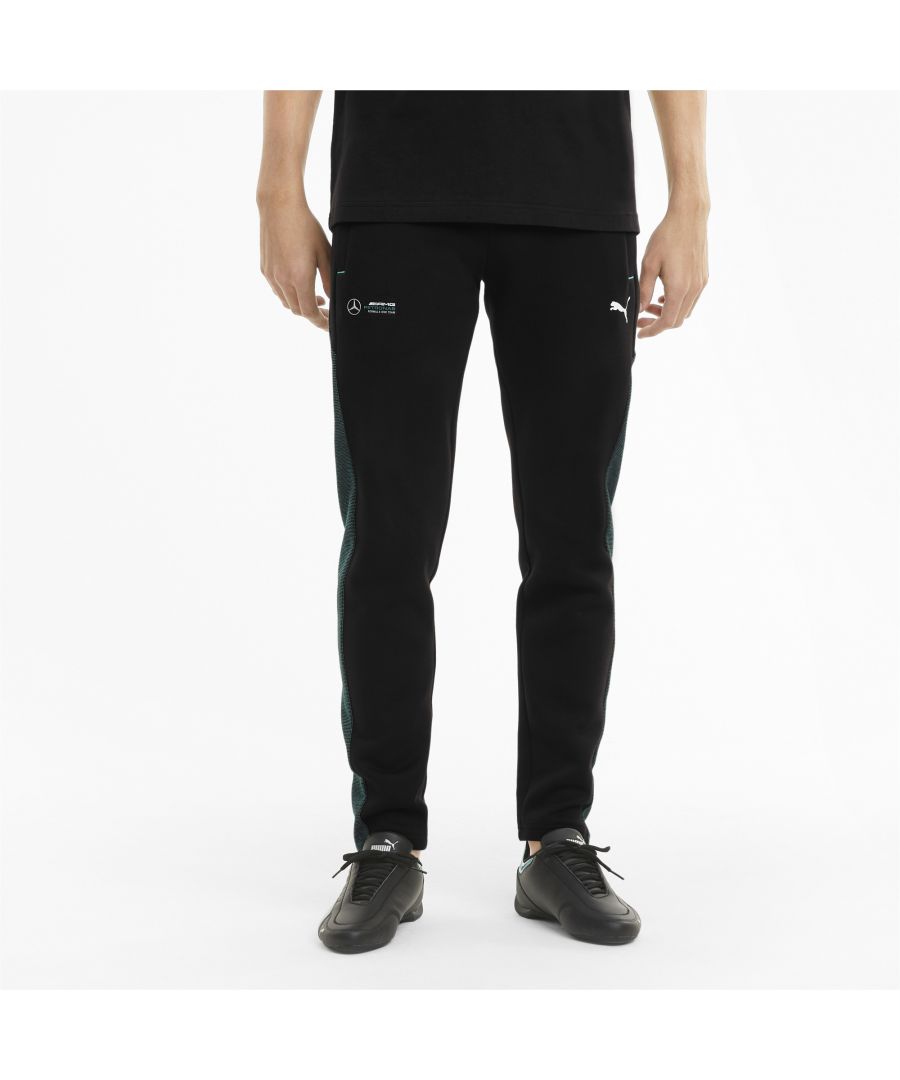 PRODUCT STORY\n\nFor high-octane fan style, these two-tone, double-sided sweatpants have a slim fit and showcase the Mercedes-AMG Petronas Motorsport badge and PUMA Cat Logo at the legs. The internal drawcord waistband and welt zip pockets are slick details that enhance the feeling of quality.\n\nFEATURES & BENEFITS\n\nBy buying cotton products from PUMA, you’re supporting more sustainable cotton farming. \nDETAILS\n\nOur model is 183 cm tall and is wearing size M\nSlim fit\nOpen cuffs\nMercedes-AMG Petronas F1 badge at leg\nPUMA Cat Logo at leg\nCotton and polyester