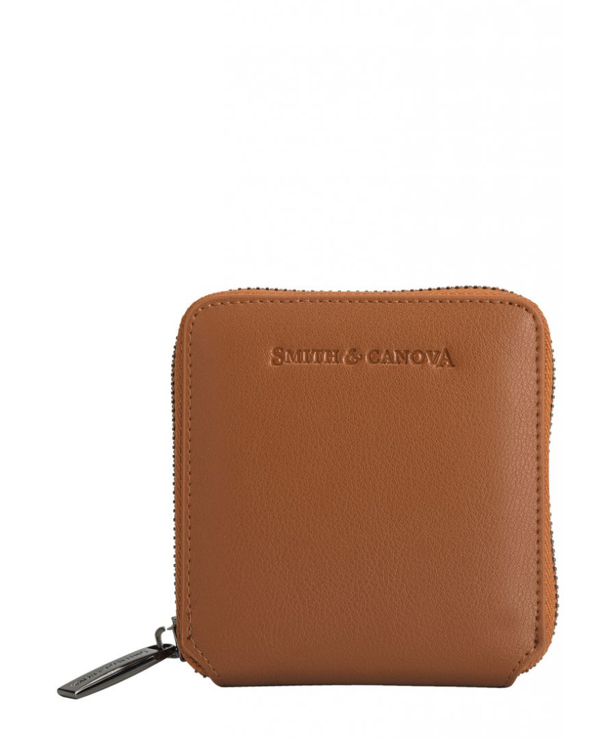 Introducing a new, sleek shape, this purse is as practical as it is stylish This everyday essential is a compact and sleek design, easily portable from your daily bag to your jacket pocket. Yet from the inside it can hold all your valuables in an organised manner with a coin purse, card holders and money slot, all delicately organised in this close packed style. Features: , Smooth Leather, Smith & Canova debossed logo, Zip around opening, Four card slots, Coin pouch, Large space for notes and receipts Style Ref: 26834 TAN
