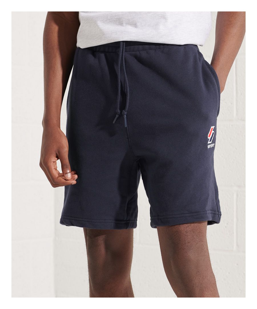Whether you're looking for a sporty look or just something you can relax in, the Sportstyle Essential Shorts are ideal for any wear.Relaxed fit – the classic Superdry fit. Not too slim, not too loose, just right. Go for your normal sizeDrawstring waistThree pocketsSignature logo patchEmbroidered logo