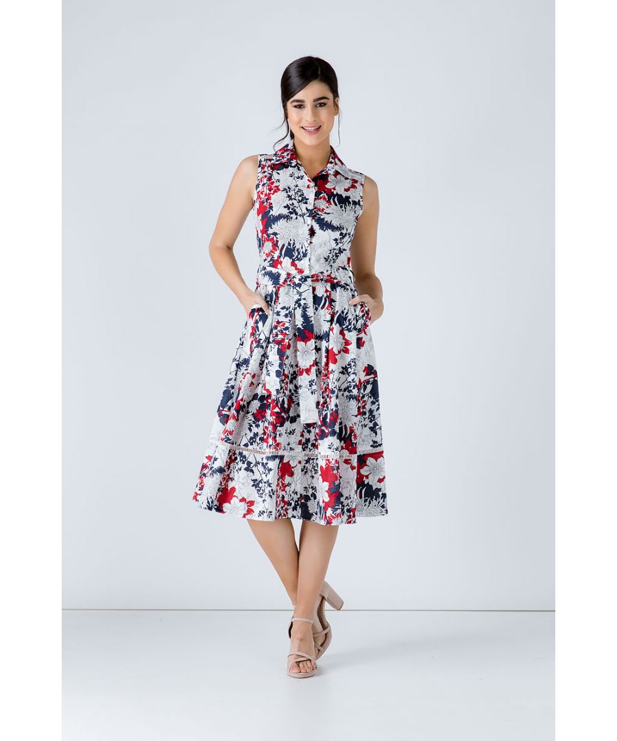 Sleeveless floral print dress in woven poplin cotton fabric. Collar and placket in the front to the hem with decorative shell style buttons. Decorative ecru perforated braid under the shoulders in the front and back and 19cm from the hem. Seam detail in the front. Darts at the bust.  Belt in the same fabric, 5cm width, with pleats below in front and behind. 2 interior pockets in the front. Our model is 172cm and is wearing size 36/S. Measurements for size 36 (in cm): Shoulder -34; Chest-42; Waist-36; Bottom-68; Body length-112. 100%COTTON