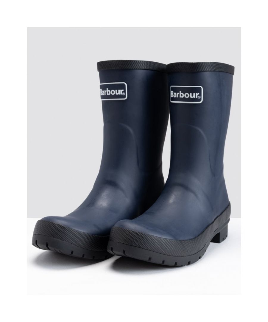 A new option for the rainy days, these mid-cut wellies are versatile enough for any outdoor activity. Made from durable rubber set atop a custom Barbour outsole with a tartan-pattern tread, the boots are finished with a Barbour branded back strip.\n\n55% rubber 45% other materials\n75% polyester 25% cotton lining\nHeavy duty branded outsole\nBranded back strip\nBarbour logo to front\nWipe clean with a damp cloth\nWe recommend using a silicone-based spray to protect and nourish the rubber\nDo not store in direct sunlight; do not dry near direct heat sources such as fireplaces or radiators