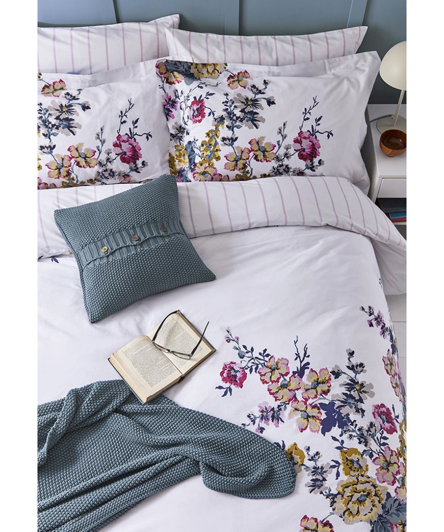 You can always rely on a traditional Joules floral to brighten a bedroom (and your day!) This duvet set is adorned with a colourful hand-drawn print set against a creme coloured background,  while its reverse is a welcome contrast of pink vertical stripes. Each set comes with two matching Oxford pillowcases (single sets come with one) and promise a cosy night's sleep thanks to the soft cotton and 180 thread count.  BCI Cotton, Made in Pakistan.