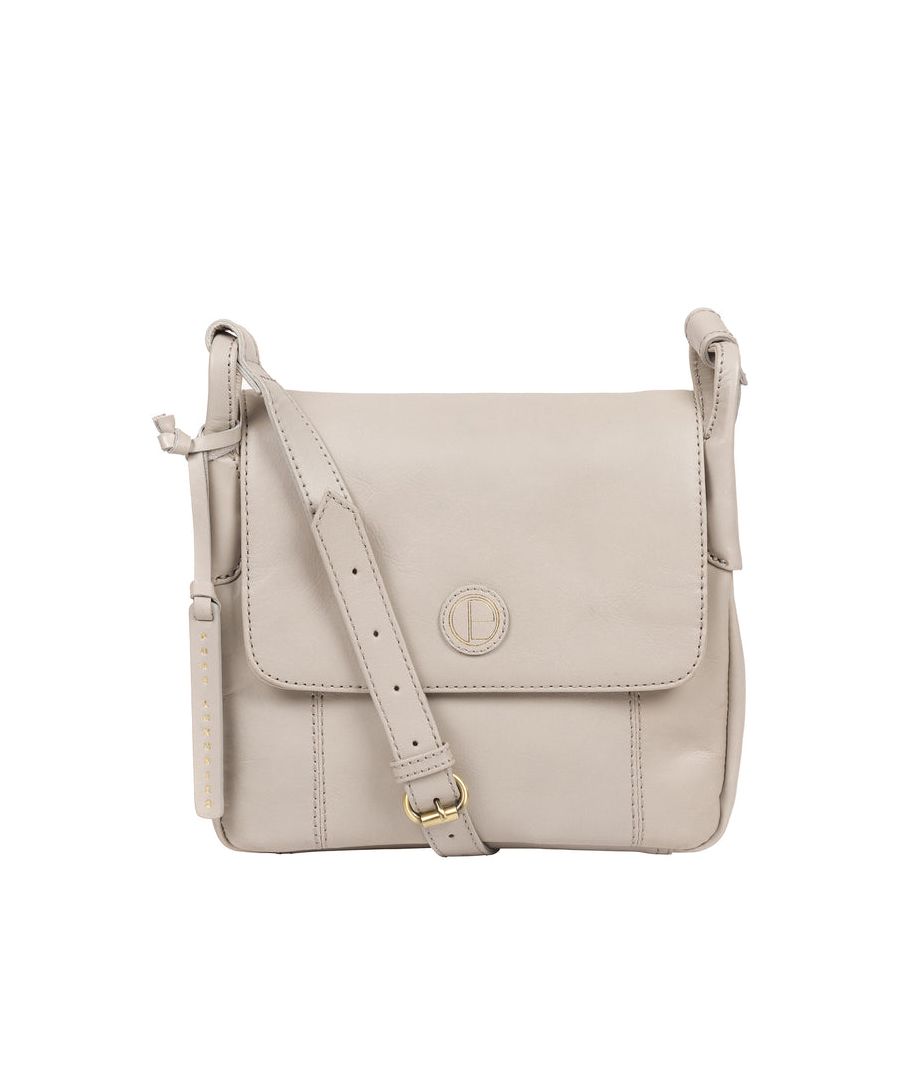 Handcrafted from natural leather with a luxurious patina, the 'Houghton' cross body bag from Pure Luxuries London is secured by a fold-over top with a magnetic fastening. The open compartment design has interior pockets to secure your essentials and convenient exterior slip pockets. Comes with an adjustable leather strap with a drop length of 60cm, to wear on the shoulder or crossbody. Adorned with the Pure Luxuries London logo and embossed leather hanging charm.