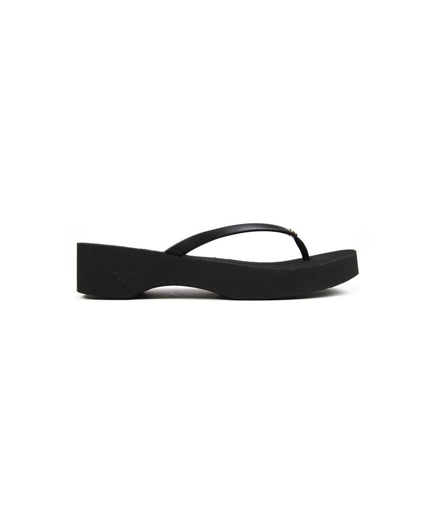 Women's Black Michael Kors Lilo Slip-on Sandal With Branded Footbed And Gold Metal Mk Logo Trim On Thong Strap. These Ladies' Flip Flops Have A Pvc Upper And A Contoured Wedge Textured Eva Sole.