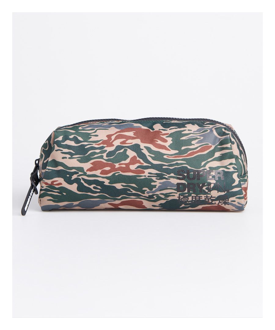 Superdry men's Classic pencil case. This classic pencil case features a zipped main compartment - plenty of room for storing all your stationery supplies. Completed with an iconic Superdry logo on the front and Superdry graphic on the zip pull.H 12cm x L 23cm x D 10cmAll over camo print