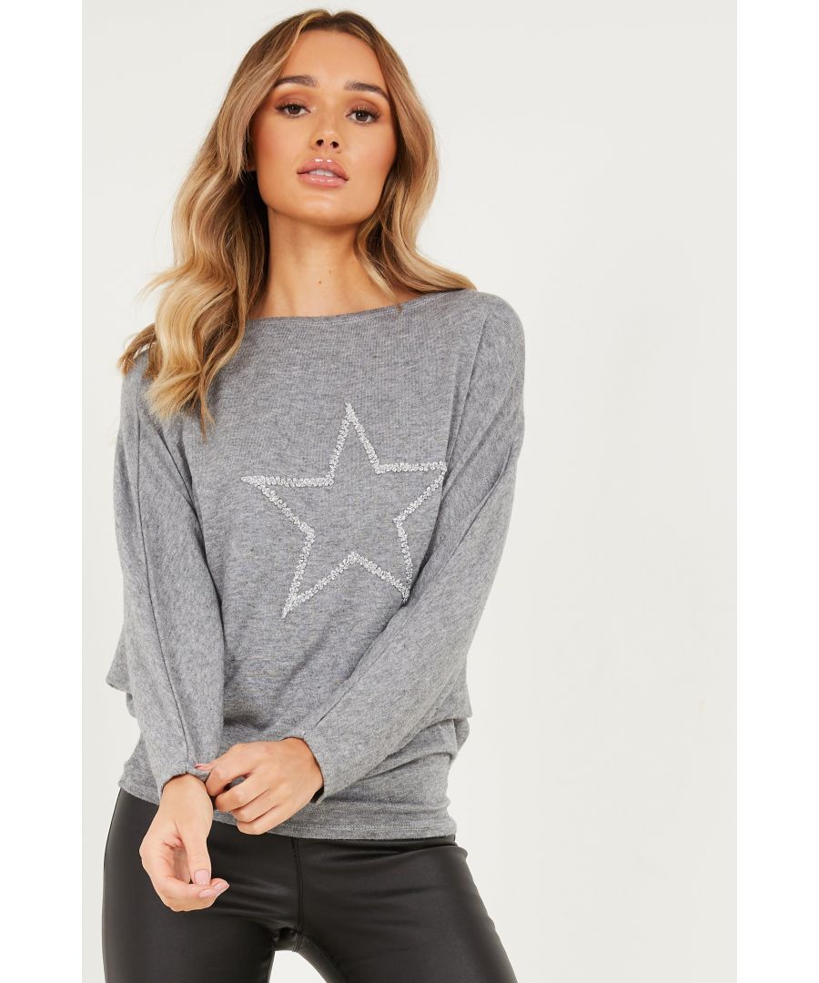 - Star design   - Glitter finish  - Light knit  - Round neck   - Batwing sleeve  - Length: 65 cm approx  - Model height: 5' 9