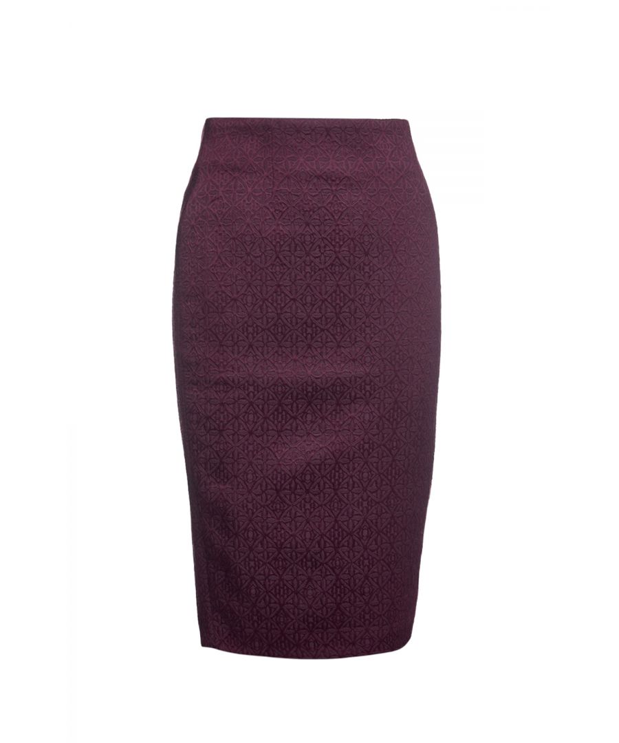 This winter pencil skirt is crafted in woven burgundy brocade style fabric. There are 2 darts below the waistband in the front and back ensuring the perfect fit. The skirt fastens in the back with a concealed zip, tone on tone.  There is a slit at the back and it is fully lined. The skirt is midi length. With just a few tweaks to your accessories, this versatile pencil skirt will allow you to glide seamlessly from desk to drinks!