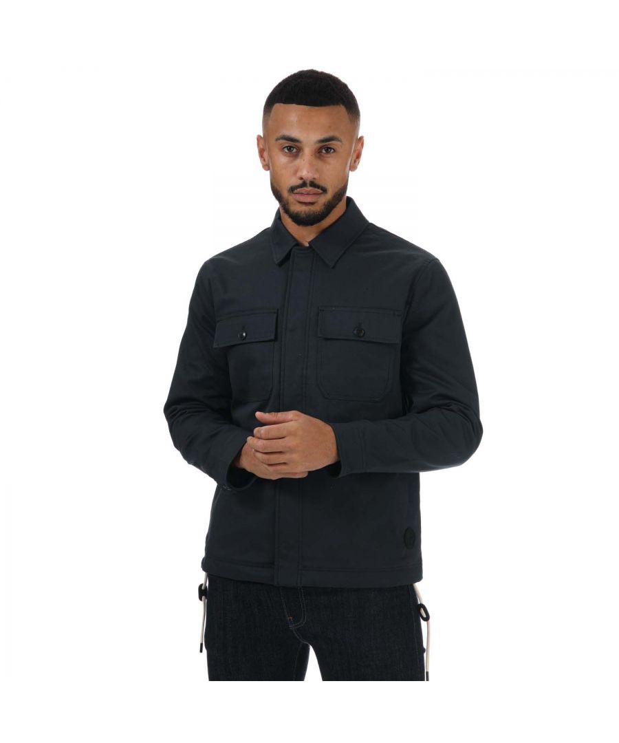 Mens Ted Baker Roster Cavalry Twill Wadded Jacket in navy.- Classic collar.- Long sleeves.- Front button fastening.- Two chest pockets.- Draw string fastening at bottom.- Structured design.- Ted Baker branded.- Shell: 97% Cotton  3% Elastane. Lining: 100% Polyester. Filling: 100% Polyester.- Ref: 256718DKNAVY