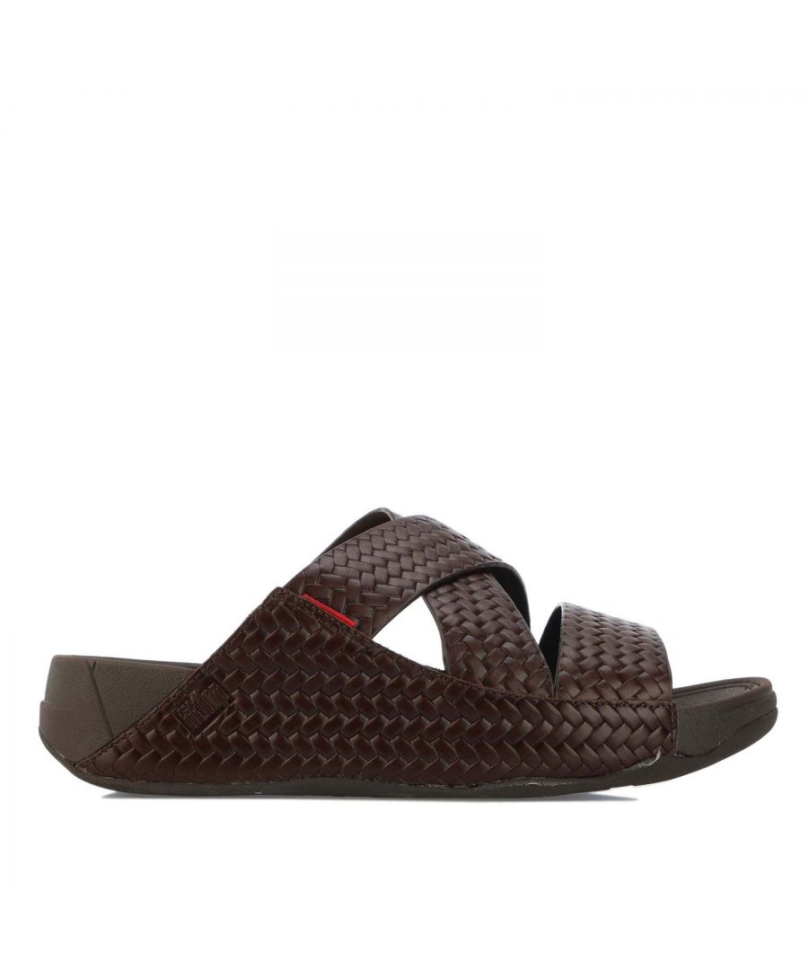 Mens Fit Flop Chi Slide In Woven Leather Sandals in chocolate.- Leather upper.- Slip-on construction.- Supercushioned  pressure-diffusing standard Microwobbleboard midsole technology.- Biomechanically engineered.- Seamless built-in arch contour.- Slip-resistant rubber outsole. - Ref:K88167