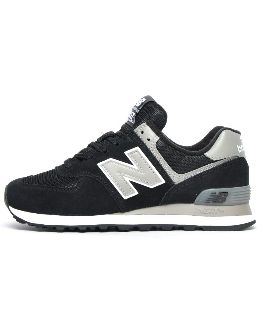 This highly renowned 574 was first Introduced in 1988 and became an instant favourite amongst runners and trendy sneaker wearers of the time. In its day the 574 blurred the lines between performance and everyday wear and hence to date has made its mark as one of the first true go-anywhere sneakers in history. This black & grey colourway is a perfect blend of fashion and function with its streamlined aesthetics and performance enhancing construction this a definite go to option for the gym and general day to day wear. Today the 574 is known worldwide for its versatility and classic design synonymous with its enviable brand heritage which will guarantee to turn heads wherever you may take them\n -Suede leather / textile mix upper\n - Secure lace up system\n - Padded heel and ankle collar\n - ENCAP midsole for added support and cushioning\n - Durable rubber outsole\n - New Balance branding throughout