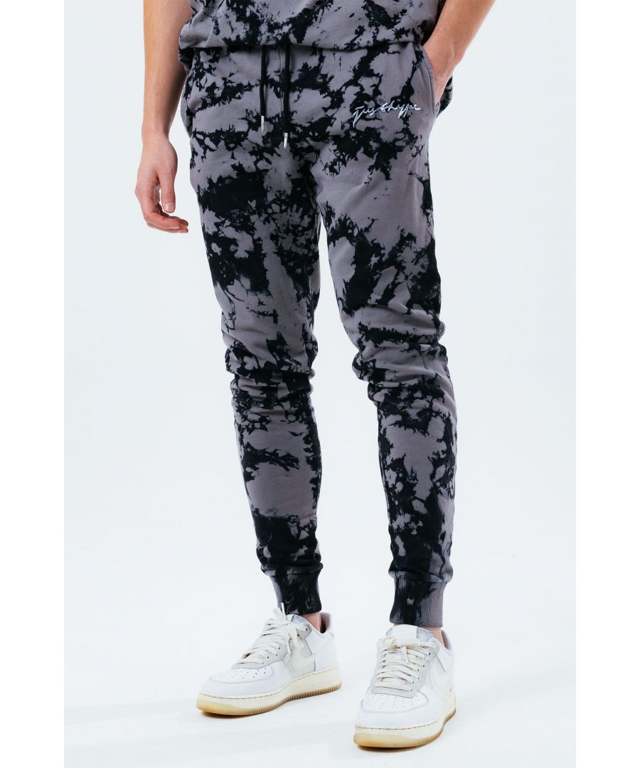 The HYPE. grey acid wash men's joggers feature a grey and black colour palette. Stay on trend and grab the matching hoodie to complete the set. Designed in a soft-touch 100% cotton fabric base with the supreme amount of comfort you need from your new joggers. The design boasts an acidic tie-dye wash finished with an elasticated waistband, drawstring pullers and fitted cuffs. Finished with the new! just hype scribble logo. Machine wash at 30 degrees.
