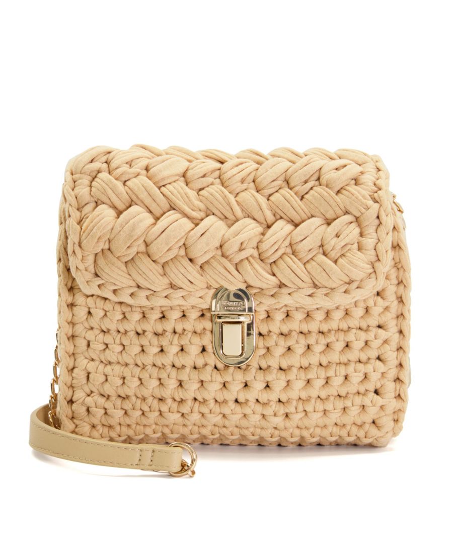 Warm-weather wardrobes are calling for Daintro. Fastened with a magnetic closure, this small woven crossbody bag has been designed in-house for a softer, more casual look and feel