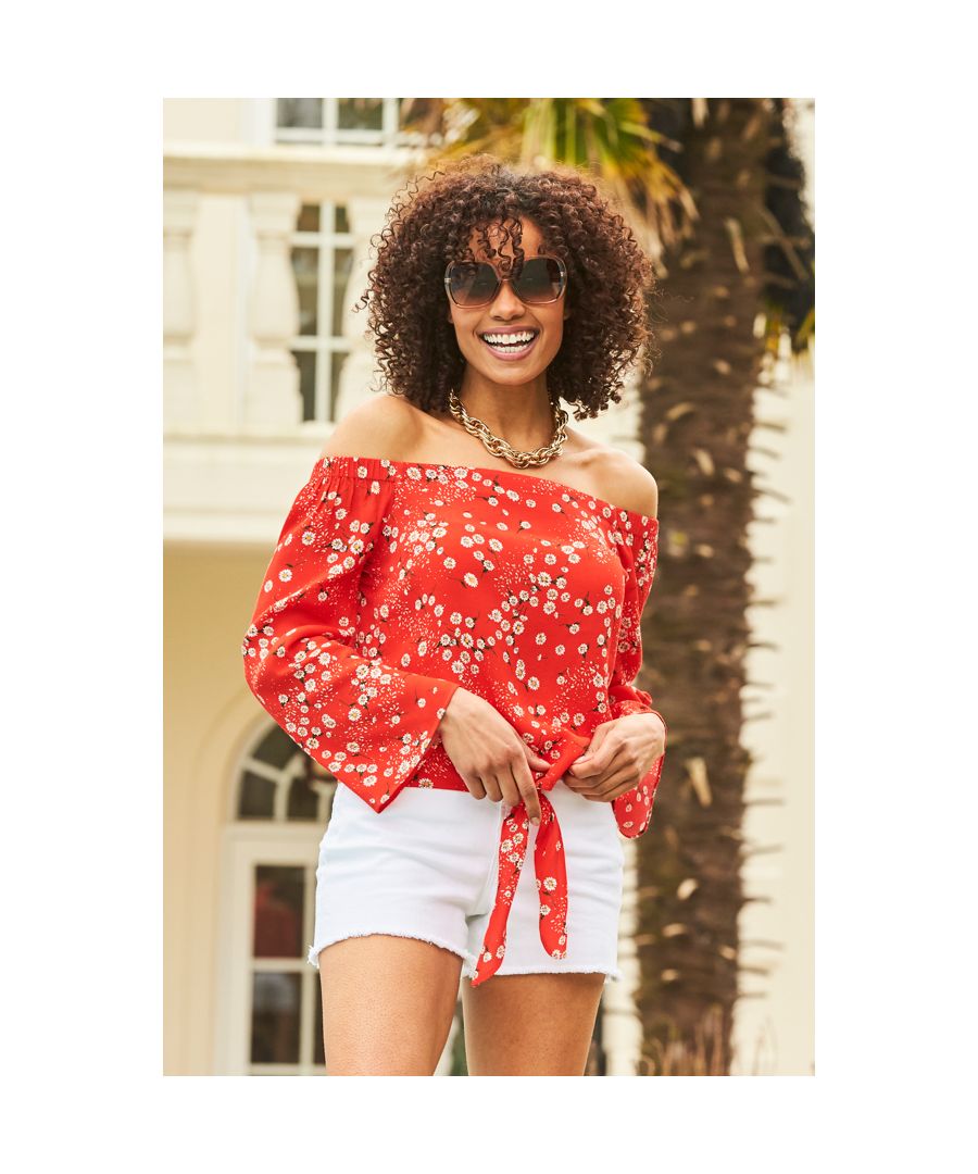 REASONS TO BUY: \n\nMeet your new favouirte floral\nStatement fluted sleeves\nDay-to-night Bardot neckline\nTie front style to show off your waist\nAdd denim shorts for the ultimate summer look\nSex it up with leather trousers