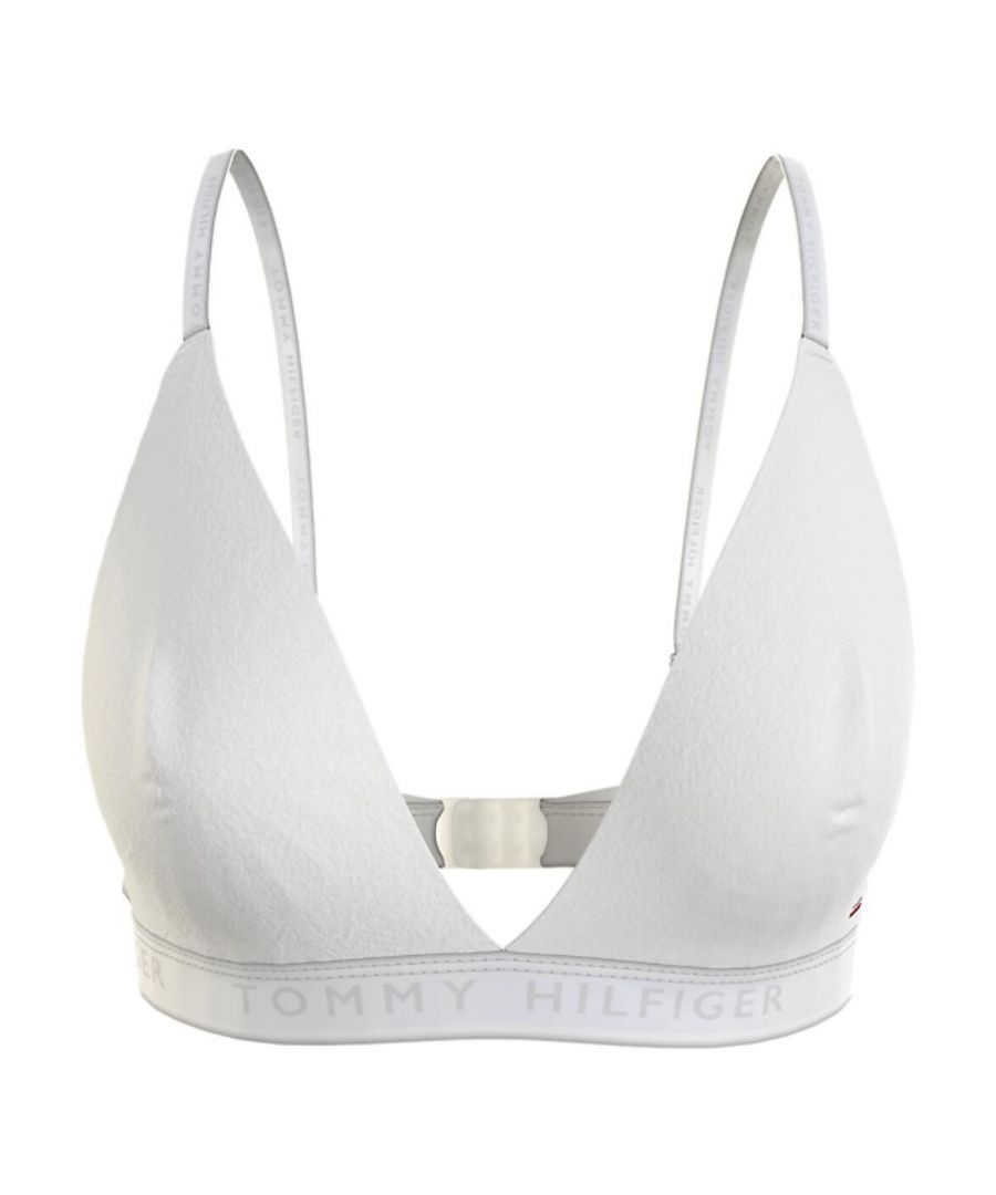 The TH seashell triangle bralette by Tommy Hilfiger lets you experience the comfort of a sports bra with a more tailoring fit offered from adjustable straps and a 3 row hook and eye fastening at the back. Deep plunging neckline allows you more flexibility with what you can wear this bralette with. The wire free design will give you comfort throughout the day. Thick elasticated band gives gives this bralette a modern feel. The mix of cotton and stretch fabric will provide maximum comfort and offer light support. Team with the matching items available to finish the look.\n\nAdjustable straps\nWireless design\nHook and eye fastening\nAdjustable straps\nMatching items available\nComposition: 39% Cotton | 34% Sustainable Modal | 22% Seacell | 5% Lycra\n\nListed in UK sizes