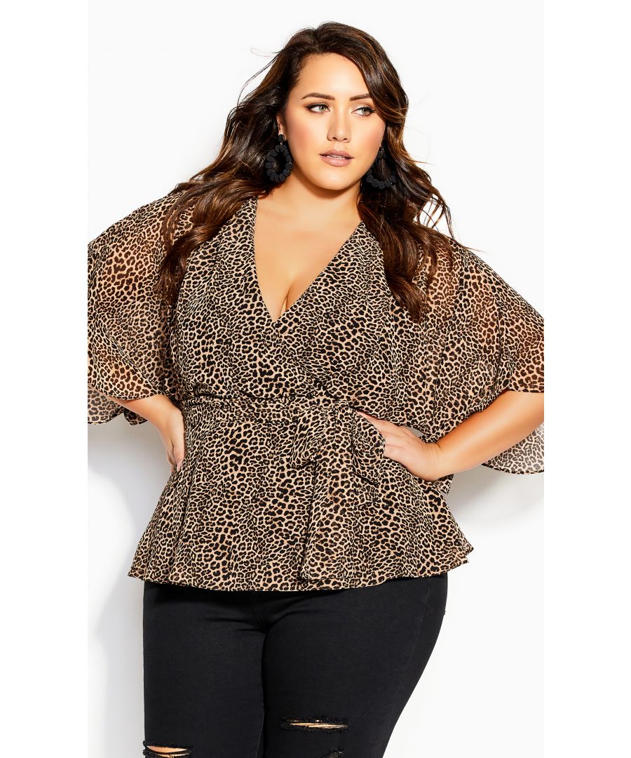 Opt for a wild print with our Wrap Leopard Top in a trendy faux wrap style. Finished with floaty sheer chiffon and a seductive plunging neck, this top is perfect for date night styling or smart casual wear. Key Features Include: - Leopard print - Plunging V-neckline - Elbow length flared sleeves - Faux wrap style - Attached self-tie waist - Fully lined - Pullover style - Slightly flared hemline Style over some tapered trousers, add a pair of patent leather pumps and finish with a bold lip! Temptress vibes, much?