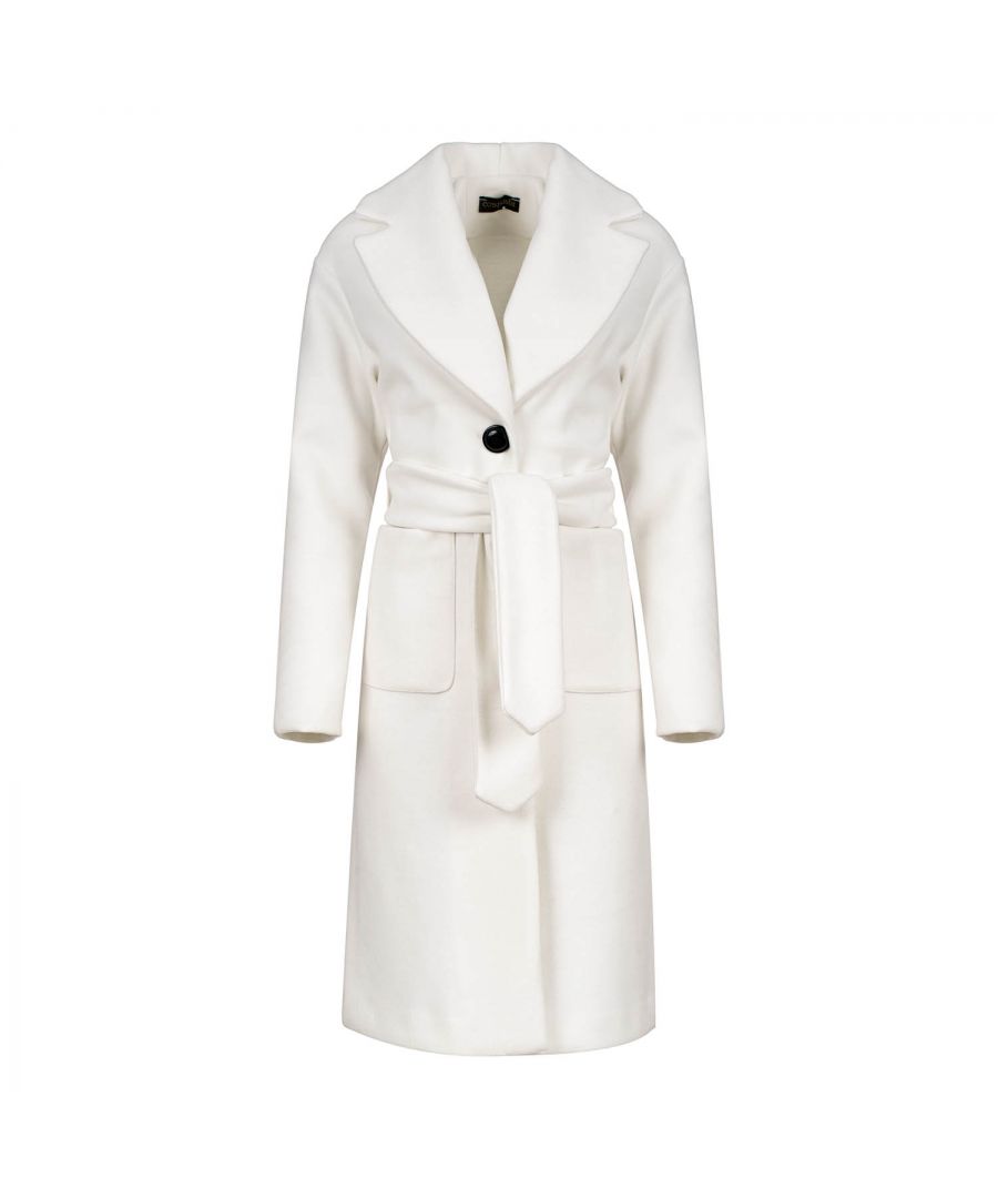 This long ecru coat is crafted in faux mouflon style fabric. There are large square patch pockets on either side. It has a large lapel and drop shoulders. The coat fastens in the front with 2 large black plastic buttons. At the waist it has belt loops on the left and right so that it can be worn with the 9cm wide belt which is in the same fabric. The coat has big slits on either side. It is styled in a straight silhouette. This piece is ideal for wear in the day or for an evening out.