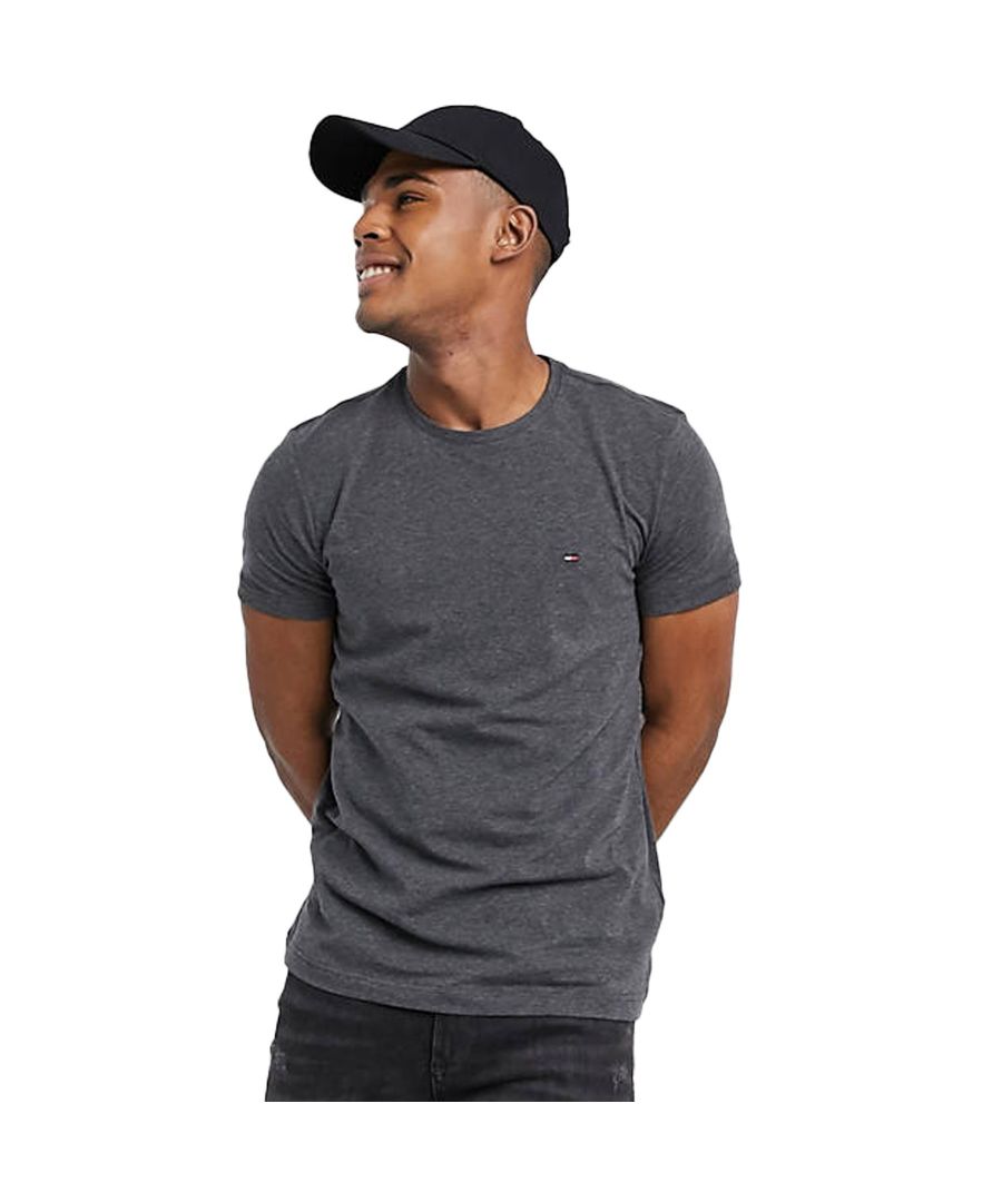 Tommy Hilfiger Men's Core Stretch Slim Fit T-Shirt. A versatile staple to add to your rotation. Styled in a classic grey colourway. Small Hilfiger flag embroidered to chest. Simple crew neck. Cool short sleeves. Made from breathable cotton with stretch