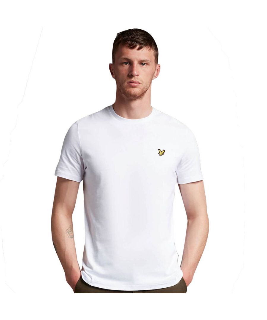 Crafted from 100% cotton from unrivalled softness, the Lyle & Scott Plain T-Shirt is an iconic style and the definition of a wardrobe staple. Featuring a classic silhouette, detail stitching at collar and cuff, plus our signature Golden Eagle, this t-shirt can be seamlessly layered or stand alone as the centrepiece of any smart-casual outfit.  \n  \nFit: Regular\nIt is crafted to fit the body neither too tightly or too loosely, leaving you with a classic, timelessly stylish look. We recommend you order your usual size, but if you're caught between two, go a size up.