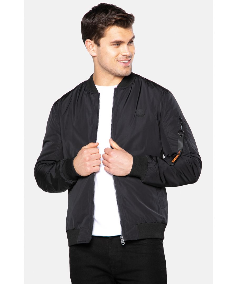 This bomber jacket by Threadbare comes with two front pockets with popper fastenings and a zipped military style pocket on the arm. There is also an inner velcro pocket and this style has a ribbed collar, hem and cuffs. Other colours available.