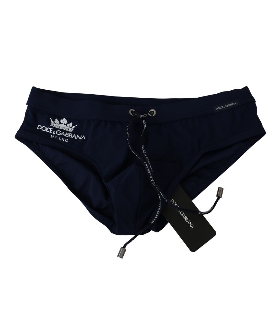 DOLCE&GABBANA. \nAbsolutely stunning, 100% Authentic, brand new with tags Dolce&Gabbana Beachwear. . \nModell: Swim briefs beachwear \nColor: Dark Blue with white crown logo \nMaterial: . 75% Nylon 25% Elastane\nWaist strap. \nLogo details. \nGreat fitting and comfort.