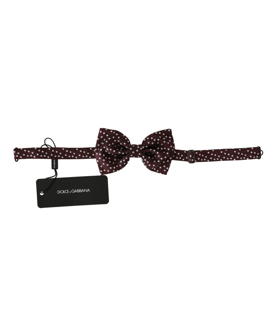 DOLCE&GABBANA Bow Tie. \nAbsolutely stunning, 100% Authentic, brand new with tags Dolce&Gabbana exclusive bow tie. \nThis item comes from the exclusive Dolce&Gabbana collection.\nColor: Purple Polka Dots. \nModel: Tied\nMaterial: . 100% Silk\nAdjustable length neck strap, one size. \nMade In Italy.