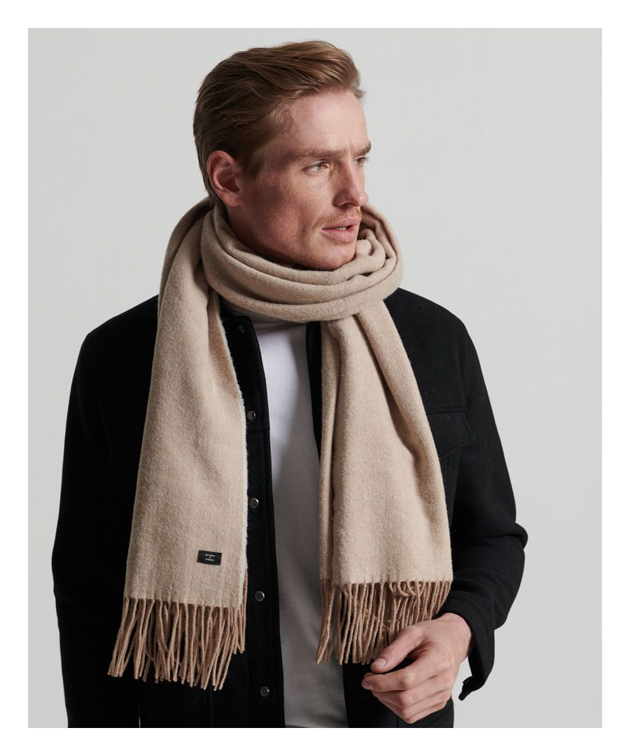 Wrap up this season, and do it in style. The Studio Scarf is a versatile, warm addition to any cold-weather look.Rich wool blendFrayed hemSignature Superdry tabL x 180cm W x 70cm