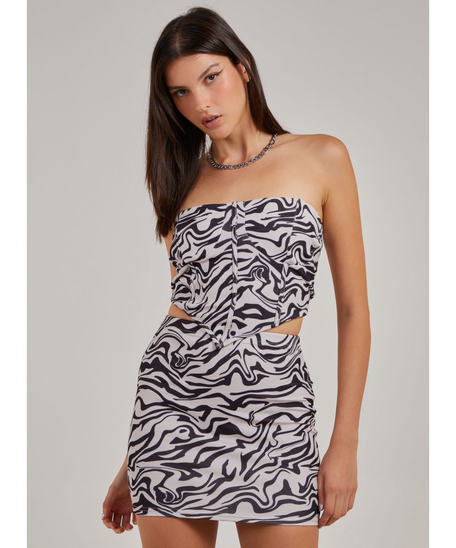 Make a statement in this Swirl Printed Corset Top. Pair with the Swirl Printed Mini Skirt for the ultimate girl's night 'fit. Wear with knee high boots.