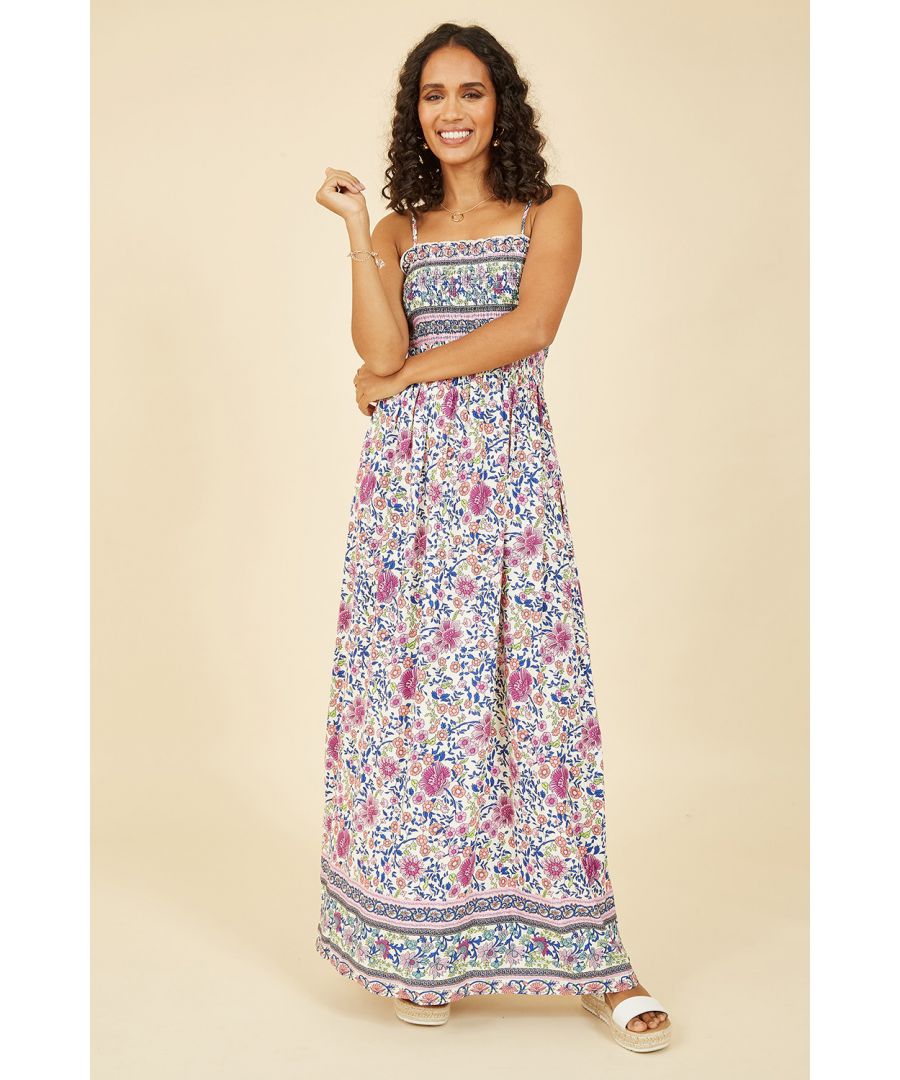 Try this pink Mela maxi dress for daytime summer plans, and make sure it has a spot in your suitcase for vacation vibes. The flowing maxi style is cool and comfortable with a shirred detailed bodice and neckline. Strappy sleeves and a border on the hemline finish this dress off perfectly, wear with a sun hat and sandals for everyday plans