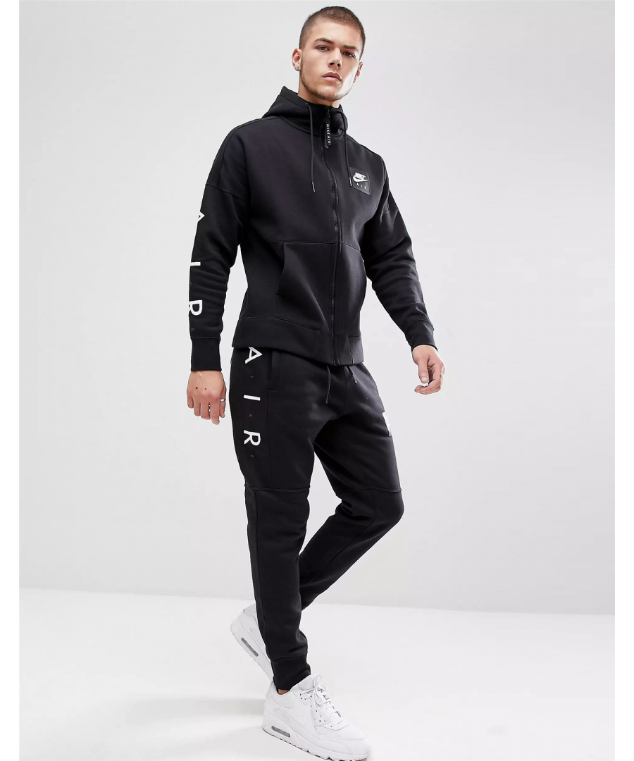 Nike Men’s Nike Air Full Zip Track Suit. \nFleece Hoody Comes Crafted with a Drawstring Hoodie.\nSplit Kangaroo Pouch with Printed Branding Decorating the Chest and Sleeves.\nAdjustable Drawcord Hood, Arm Print.\nLogo Patch to Chest.\nRibbed Cuffs & Hem.\n80% Cotton, 20% Polyester.\nMachine Washable.