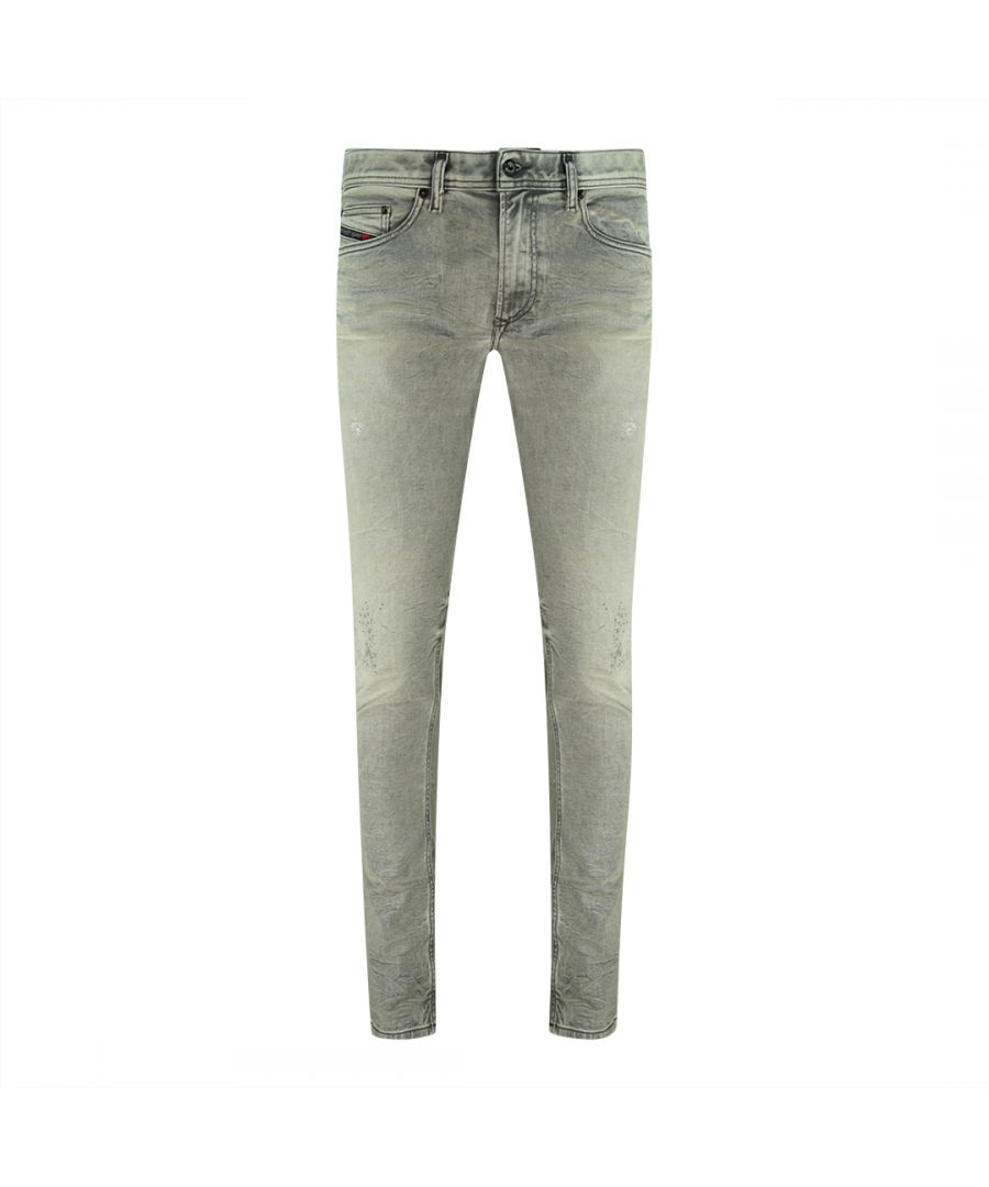 Diesel Thavar-XP R99J6 jeans. Verweerd en vervaagd, vlekeffect. 72% katoen, 17% polyester, 9% viscose, 2% elastaan, stretchdenim. Skinny pasvorm. Ritssluiting. Diesel Thavar-XP R99J6 jeans