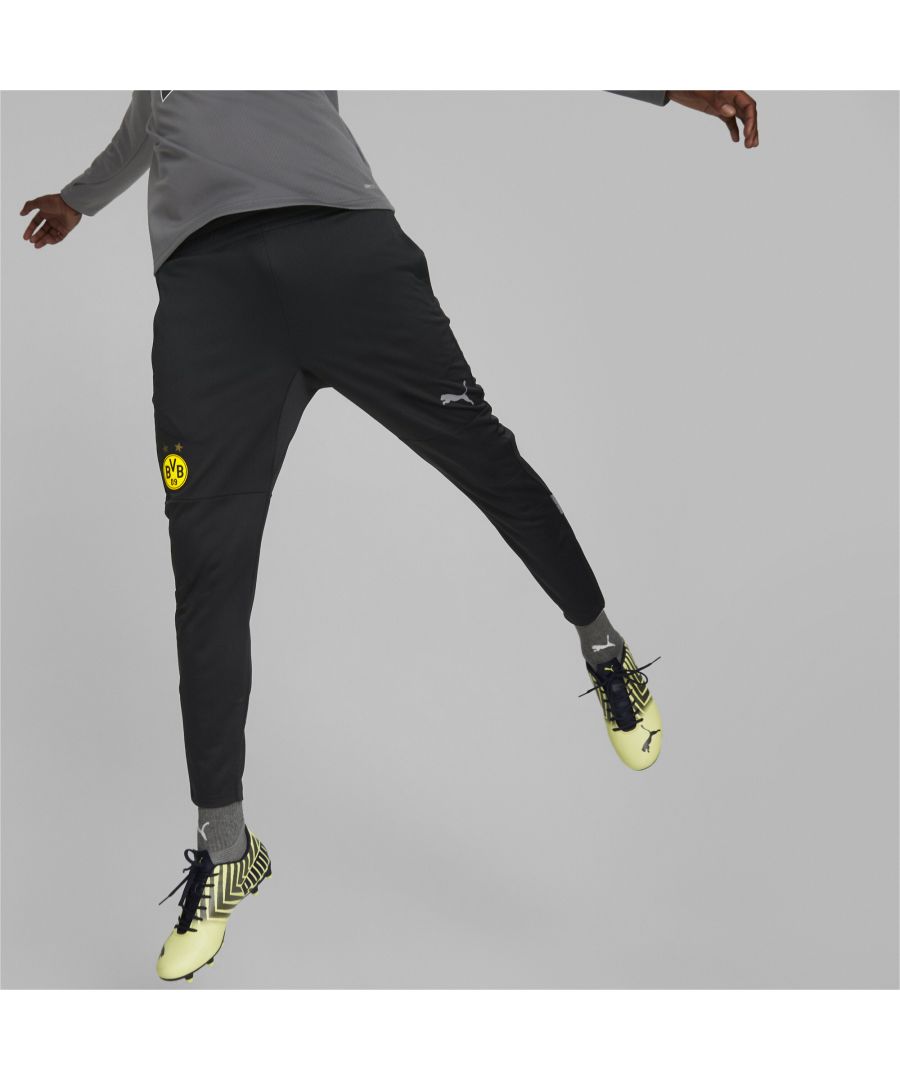 PRODUCT STORY Heja BVB! Control the practice pitch just like Borussia Dortmund in these training pants engineered for perfect performance. Their lightweight, moisture-wicking construction will keep you agile and cool during a strenuous session, so you’ll be poised to take on the world’s footballing giants like Die Schwarzgelben. FEATURES & BENEFITS : dryCELL: Performance technology designed to wick moisture from the body and keep you free of sweat during exercise Recycled Content: Made with at least 20% recycled material as a step toward a better future DETAILS : Official crest on leg PUMA Cat branding on leg Articulated knee darts Rubber print on legs Invisible zipper Slim fit