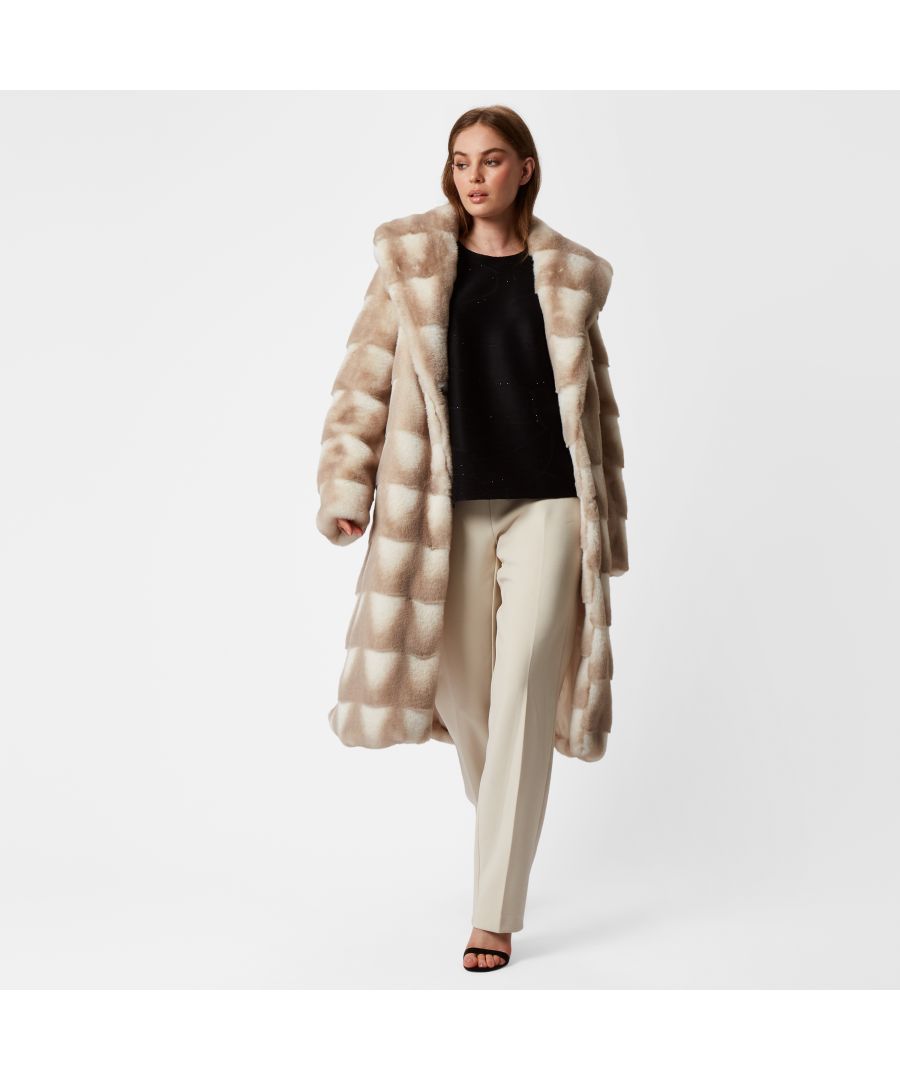 For the ultimate elegant Winter coat, this 2 tone faux fur will be a head turner. Featuring a dual natural tone palette, sumptuous layers of soft faux fur, concealed side pockets, falling mid calf, finished off with a large chic wide lapel collar.