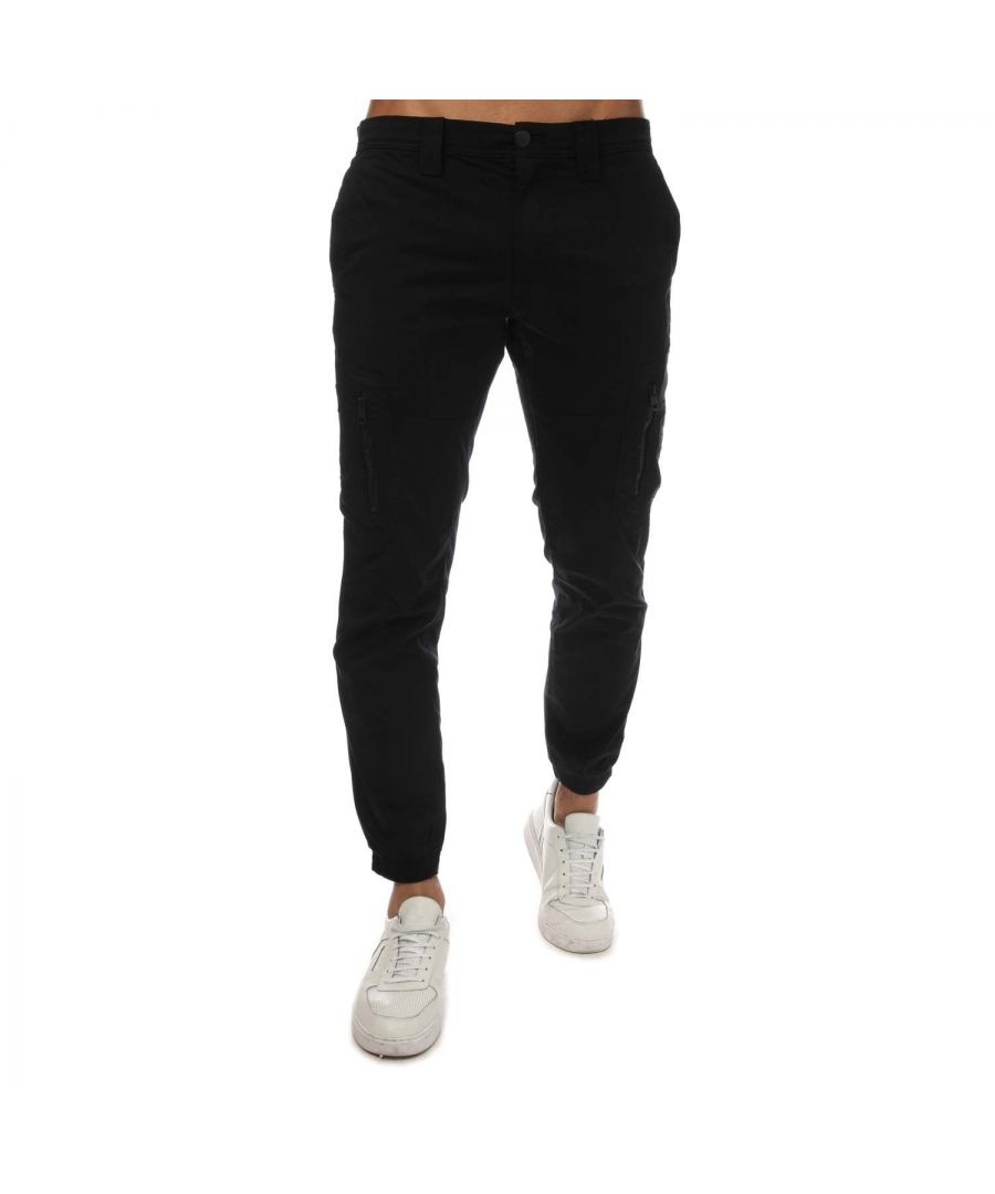 Mens Calvin Klein Skinny Washed Cargo Pants in black.- Zip fly and button fastening.- Pockets on the sides.- Two zippered cargo pockets on the leg.- CK logo patch on the left leg.- Elasticated ankles.- Tapered leg.- Skinny fit.- 97% Cotton  3% Elastane.- Ref: J30J320891BEH