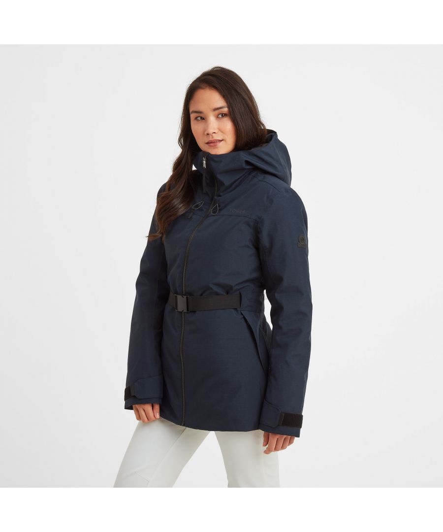 Look stunning on the slopes and stay warm and dry in the snow with our Dusk ski jacket.  Fully waterproof, windproof, and breathable, the shaped belted style is easy to wear and very flattering.  Insulated for warmth, it gives you full protection on the pistes, or just wearing to walk the dog across the Yorkshire moors. Dusk comes in a durable, ripstop fabric with an invisible water repellent coating, so that rain beads off, and it has taped seams to stop water getting in. It comes with all the features you need on the slopes, including a lift pass pocket on the sleeve, zip openings under the arms for ventilation, an internal mesh pocket for your goggles, plus a handy  goggle wipe. An inner snowskirt stops the white stuff going up your back in a fall and there are soft, stretchy snow cuffs with discreet thumbholes at the wrists to fill the gap between jacket and gloves. When you're not wearing them, your gloves can be attached to the D ring at the hem. The hood has a shaped and fused peak and fits over a helmet, but when you take the helmet off, you can adjust it at the front and back to keep the wind and rain out. There is also a deep, cosy neckline to snuggle into. Dusk comes in a feminine shape that is slightly longer and has an elasticated belt at the front so you can cinch the waist in for a flattering fit. There are also two vents at the back for full ease of movement.