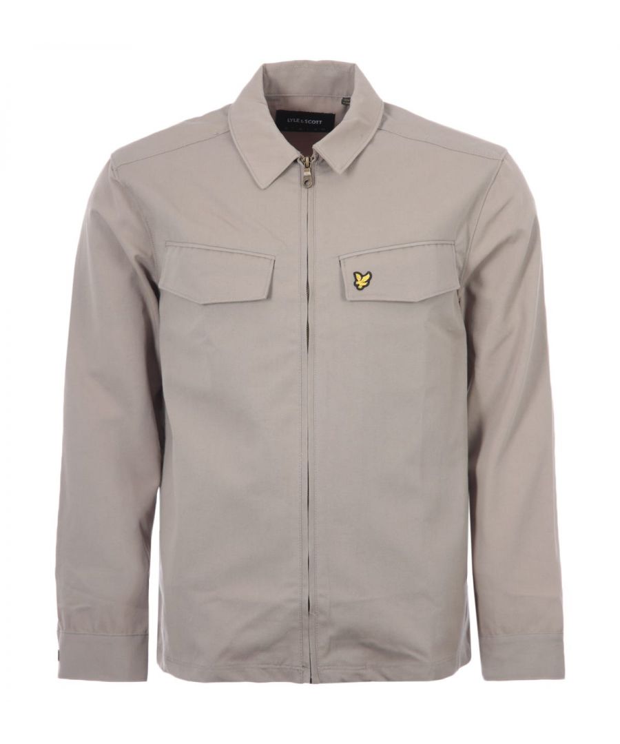 Style, quality and quintessentially British, Lyle & Scott  has over 100 years\' worth of technical expertise going into their products. Traditional garments have been given an injection of contemporary aesthetics but don\'t forget that iconic Golden Eagle logo, you\'re immediately recognised to be wearing a reputable brand.The Pocket Overshirt is an elevated version of a classic overshirt. Crafted from a durable blend of cotton and polyester. Featuring a pointed collar, full zip closure, twin chest pockets and buttoned cuffs. Finished with the iconic Golden Eagle logo embroidery on the chest.Regular Fit, Cotton Poly Blend, Pointed Collar, Full Zip Closure, Twin Chest Pockets, Buttoned Cuffs, Lyle & Scott Branding. Style & Fit:Regular Fit, Fits True to Size. Composition & Care:65% Polyester, 35% Cotton, Machine Wash.