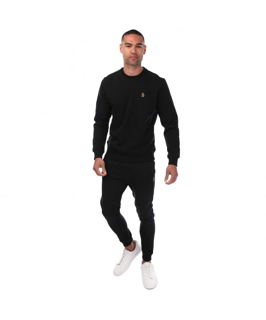 Luke 1977 is, without a doubt, the go-to brand if you're after a well crafted, witty and masculine item. Finished with the signature Luke Lion logo and taping, you're looking at one of the UK\'s top contemporary menswear brands. The Runner Crew Neck sweatshirt combines comfort and style, ensuring you look great in and out of the house. Crafted from a brushed back cotton blend, featuring a classic crew neck design with long sleeves and ribbed trims. Regular Fit. Cotton Blend Brushed Back. Ribbed Crew Neck. Long Sleeves. Ribbed Cuffs & Hem. Luke 1977 Branding. Luke 1977 is, without a doubt, the go-to brand if you're after a well crafted, witty and masculine item. Finished with the signature Luke Lion logo and taping, you're looking at one of the UK's top contemporary menswear brands. The Runner Crew Neck sweatshirt combines comfort and style, ensuring you look great in and out of the house. Crafted from a brushed back cotton blend, featuring a classic crew neck design with long sleeves and ribbed trims. Regular Fit. Cotton Blend Brushed Back. Ribbed Crew Neck. Long Sleeves. Ribbed Cuffs & Hem. Luke 1977 Branding