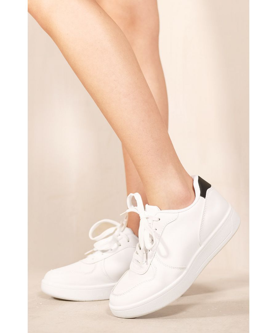Women's chunky sole lace up sneakers. A perfect addition to your Spring/Summer wardrobe. The classic white trainer with a black collar will pair perfectly with a dress, shorts, denimwear or just going for that stylish chic casual look.