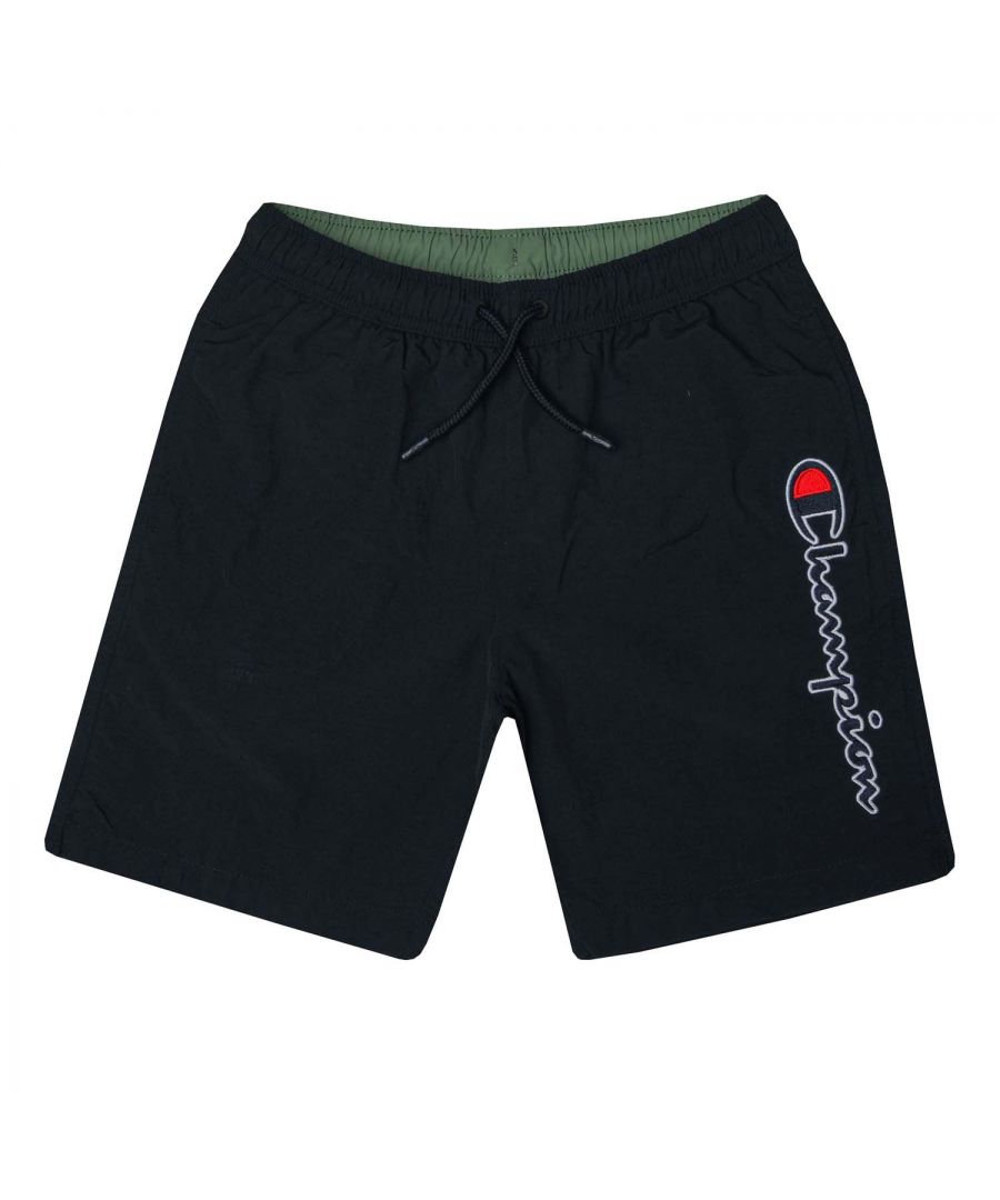 Junior Boys Champion Logo Swim Short in black.- Drawstring waist.- Side pockets.- Vertical script logo detail.- C logo patch detail.- Quick drying.- Body: 100% Polyamide. Inserts: 100% Polyester.- Ref:306014KK001J