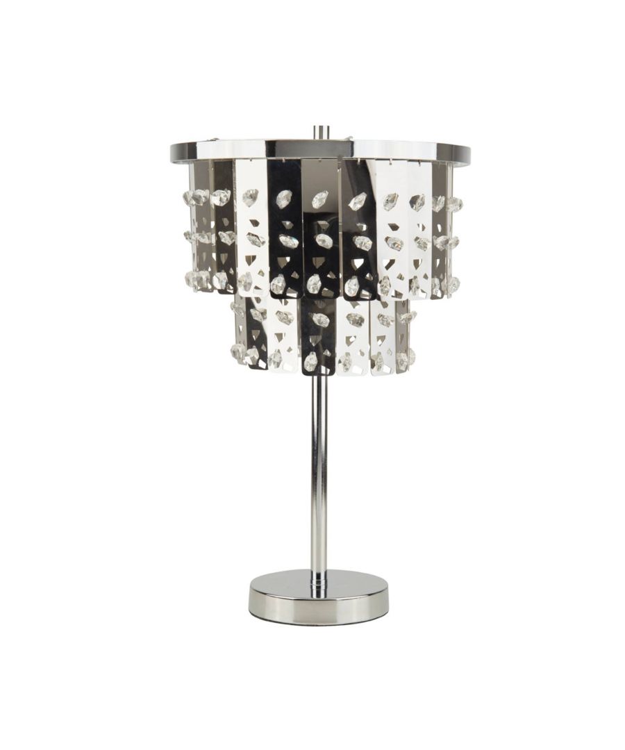 Glamorous table lamp boasting a polished chrome finish. Height: 45cm Diameter: 27cm Maximum Wattage: 60w Light Bulb: 1 x E14 Light Bulbs (Not Included) A beautiful addition to your home, this table lamp is part of the Marquette range from Pagazzi Lighting. Boasting a polished chrome finish throughout, the lamp features two tiers of rectangular droplets, which feature cut out segments. Crystal bead detailing completes the look, creating a mesmerising shine when lit. It is ideal for use in lounges, hallways and bedrooms.