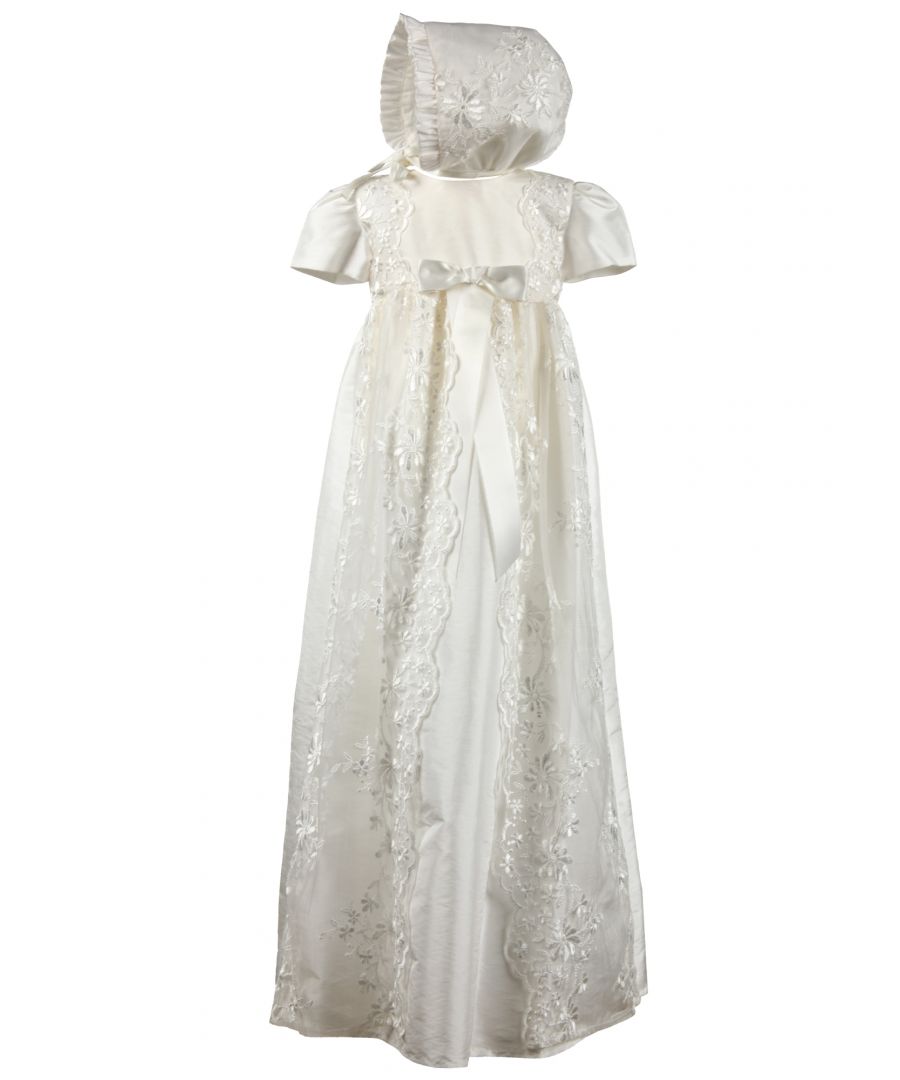 Fairly new to our traditional gown collection is style HARMONY Christening robe.  Suitable for baby girls or boys, this would make a beautiful heirloom. \n \nThis long christening robe is made from our popular Mock Silk, easy for spot cleaning when your little one has that inevitable milk burp. We've all been there...\nIt has short sleeves and beautiful lace details on the body running down the full length of the skirt. \nWe've added some lace detailing to the back as well. Don't forget when you hold your baby towards you, the back of the dress will be seen by everyone. It's always good to have some interesting details on the back. The opening is a concealed zip fastening.\nWe've complimented this gown with a matching bonnet that ties at the neck. Traditional and classic throughout.\n \nWe always line our dresses and robes in 100% lightweight Cotton fabric which is cool and better against babies body, especially if they have sensitive skin\n \nThe outfit arrives to you on a Satin padded hanger and protected by one of our Heritage keepsake garment bags.\n \nOuter - 100% Polyester Mock Silk - Ivory\nLining - 100% Cotton\nDry Clean or Hand Wash