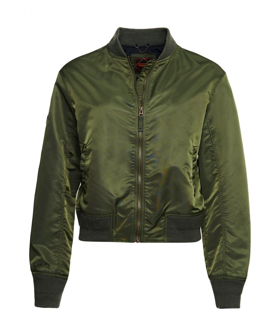 Take to the skies in the MA1 Bomber jacket featuring a zip fastening, two pockets, and signature logo metal badges throughout. Relaxed fit – the classic Superdry fit. Not too slim, not too loose, just right. Go for your normal size. Zip fastening. Ribbed cuffs and hem. Two pockets. Signature logo metal badges.