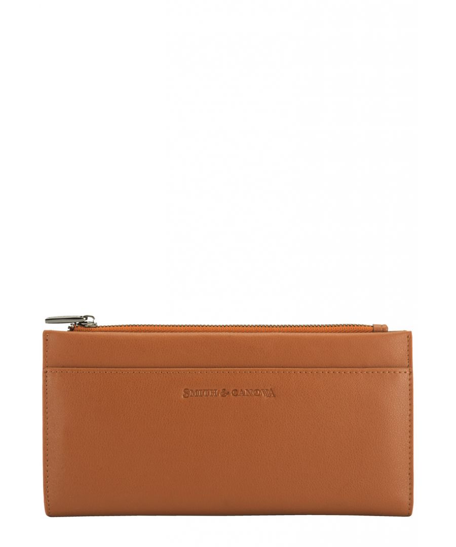 Looking for an everyday classic? Made from genuine leather with a delicate debossed logo, this minimal piece is the perfect season statement. Featuring multiple card slots keeping all your valuables are safe. Features: , Genuine Leather, Zip top, Smith & Canova debossed logo, Zip top pocket, Snap open section, Multiple card slots Style Ref: 26830 TAN